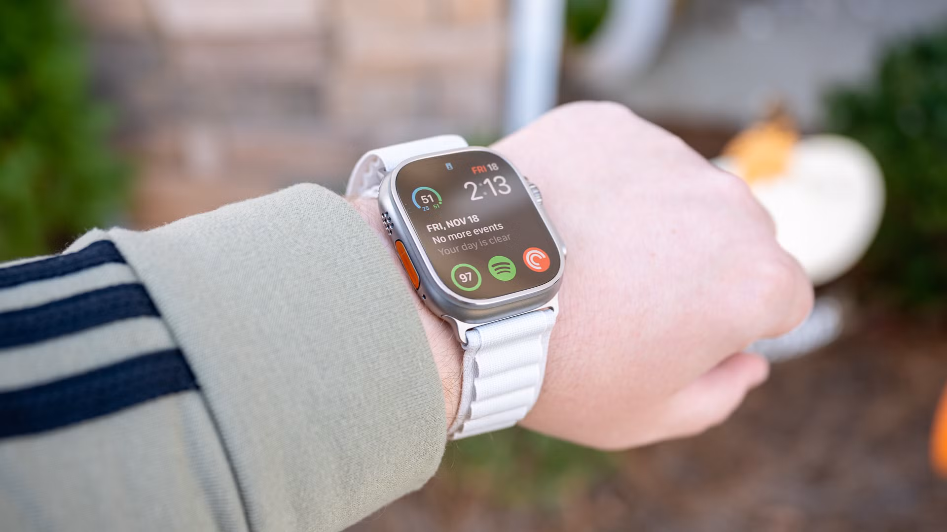 Person wearing the Apple Watch Ultra with the Ocean Band watch band.
