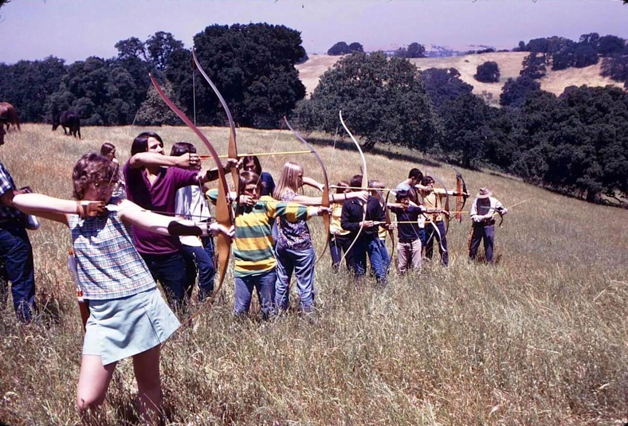 Teenagers honing their skills in archery