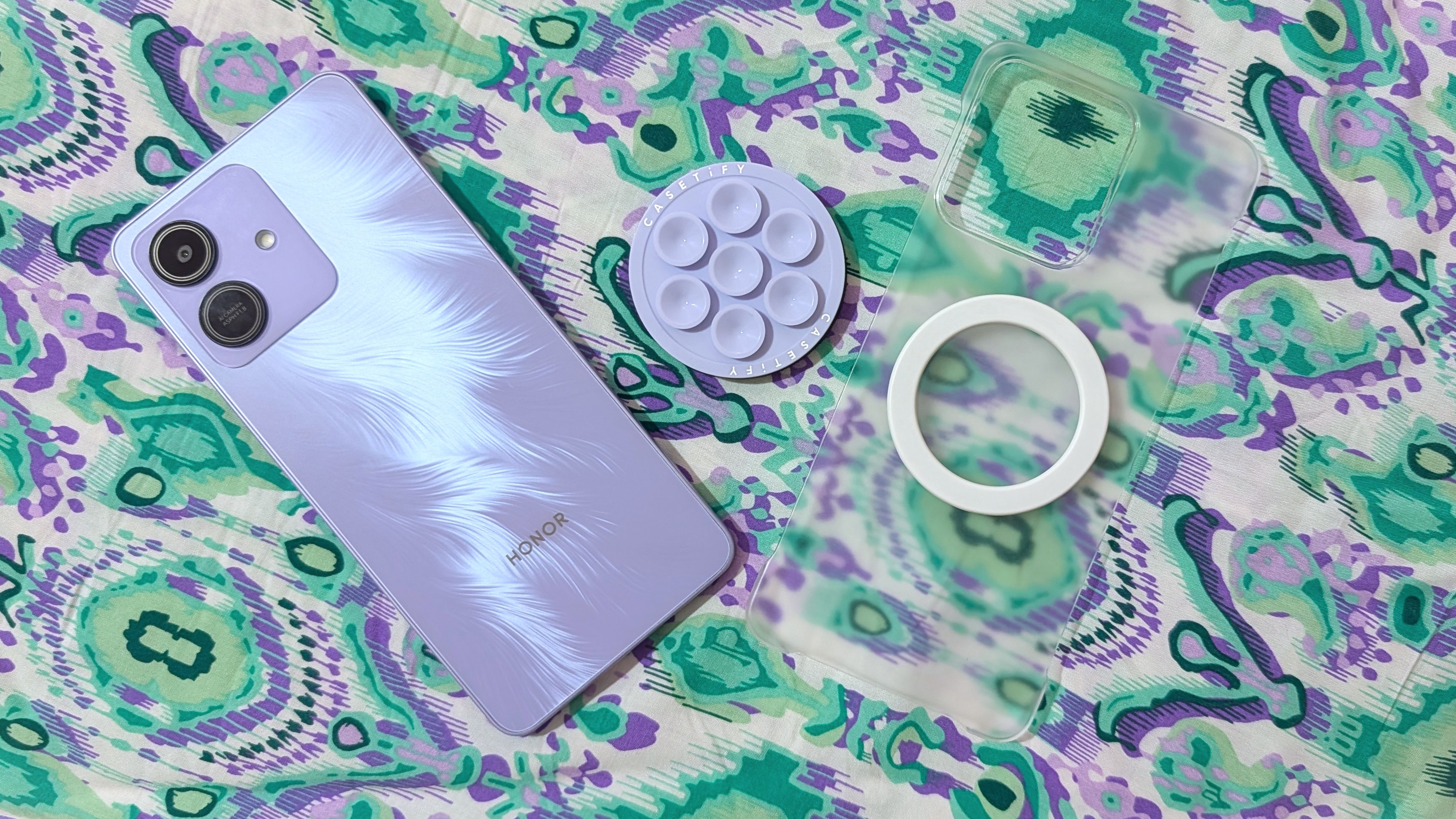 Honor Play 10 with a clear case and magnetic accessories.