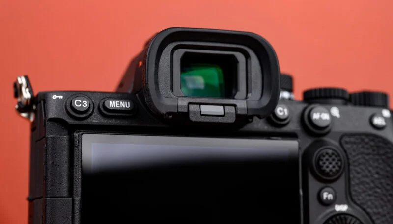 Close-up of the back of a digital camera showing its viewfinder and control buttons.